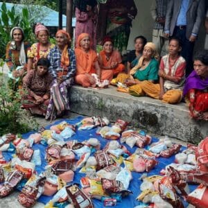 Home 2 Distributing food materials to the respected elders